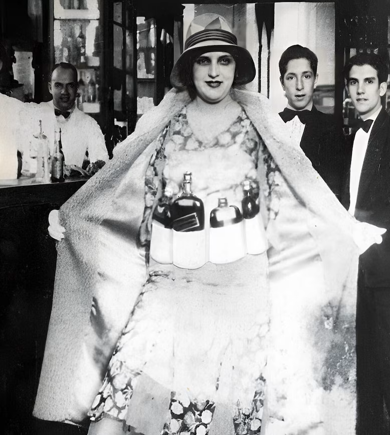 During Prohibition (1920-1933), women took advantage of their lower suspicion rate to smuggle alcohol. Many hid bottles in their clothing, baby carriages, or even hollowed-out books. Their creativity and resourcefulness made them key players in illegal liquor distribution, often working independently or for organized crime networks that relied on their discretion and mobility.